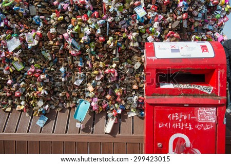 SEOUL - March 14 : Love padlocks at N Seoul Tower or Locks of love is a custom in some cultures which symbolize their love will be locked forever at Seoul Tower on March14,2015 in seoul,Korea.