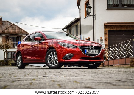 FRANKFURT - MARCH 21, 2014: All-new Mazda 3 1.5 Skyactiv at test-drive event held on March 21 near Frankfurt. The new Mazda 3 is one of the best-handling cars in its class.