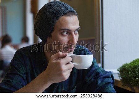 Young adult arabian man in cafe