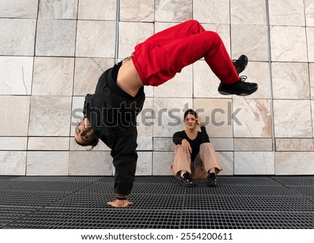 Similar – Image, Stock Photo Woman performing handstand while practicing yoga on street