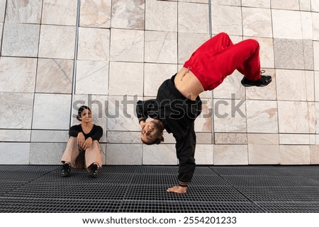 Similar – Image, Stock Photo Woman performing handstand while practicing yoga on street