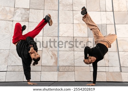 Similar – Image, Stock Photo Woman performing handstand while practicing yoga on street