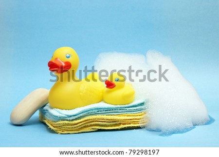A group of rubber duckies and other bathing items come together to conceptualize a juveniles bath time.