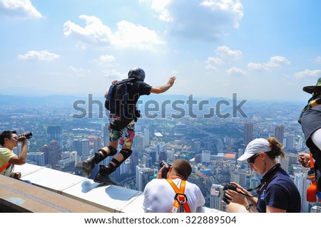 Kuala Lumpur, Malaysia-October 08, 2010: A BASE jumpers in jumps off from KL Tower. KL Tower BASE Jump is an annually event and participants from experienced BASE jumpers from all around the world.
