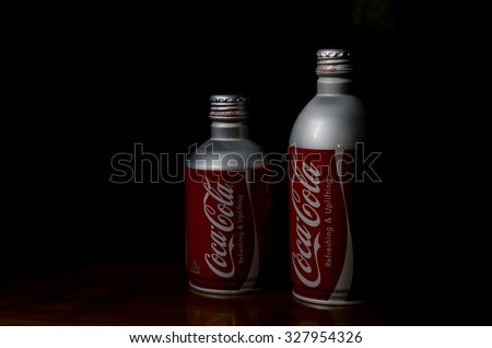 SABAH MALAYSIA - OCTOBER 16, 2015 Editorial photo of  Coca-Cola bottle isolated on black Background. Coca-Cola Company is the most popular market leader in Malaysia.