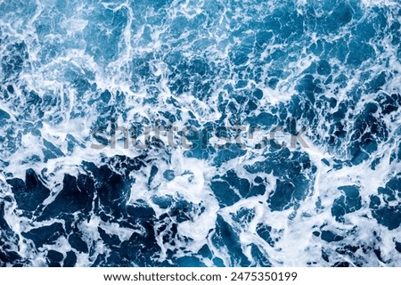 Similar – Image, Stock Photo Foamy waves of sea splashing on rocky shore in sunlight