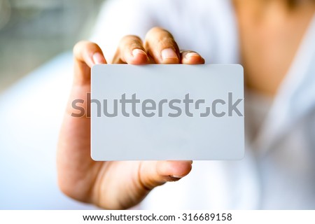 Business woman hand showing business card.