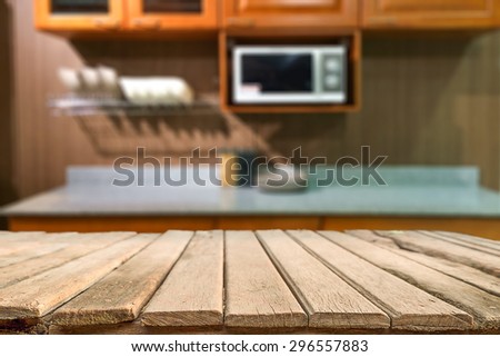 wooden desk space platform on blurred kitchen bench background