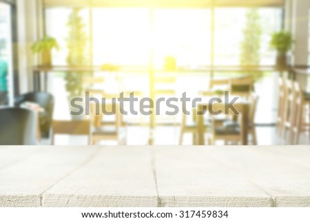 Empty wood table and blurred cafe light background. product display template. Business presentation