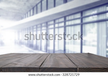 Space of wood table platform and atmosphere around office blur background for product presentation.