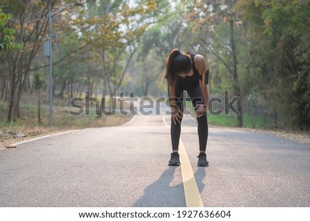 Similar – Image, Stock Photo Attractive female runner taking break after jogging outdoors