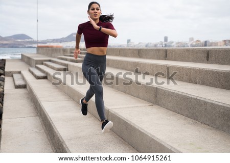 Similar – Image, Stock Photo Young brunette Woman running on asphalt road in summer park. Active sporty caucasian female has morning workout. Athletic person in sportswear exercises outdoor. Dressed leggings and sportive top