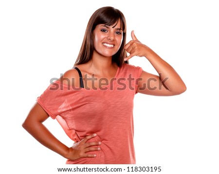 Pretty young woman looking at you saying call now on isolated background