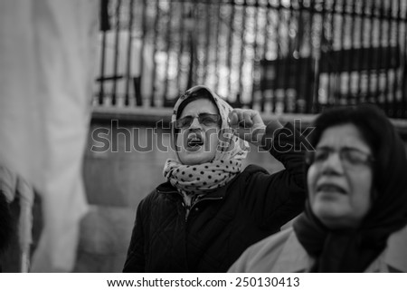 LONDON - JANUARY 24, 2015: Unidentified woman protests outside Downing Street calling for the end of executions in Iran.