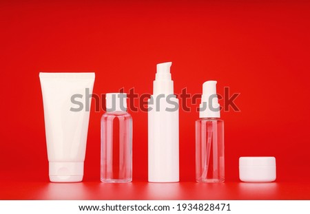 Wide set of cosmetic products for skin care against red background. Concept of daily skin cleani Foto stock © 