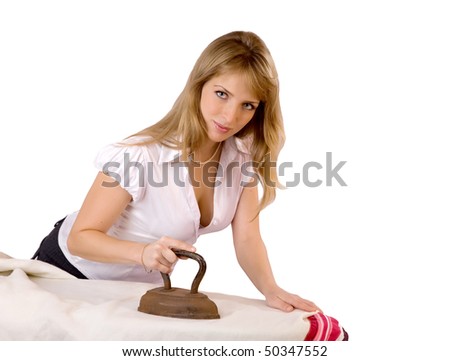 The girl irons an old iron on a white background