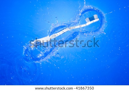 Toothbrush and splashing water. Health care