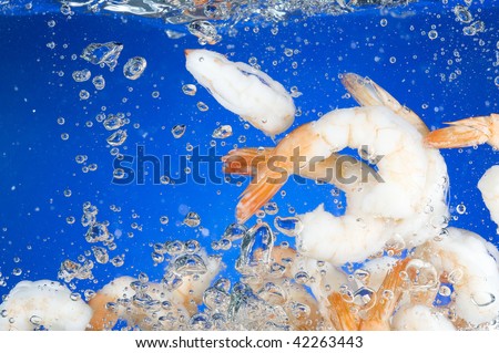 Shrimp cook in blue water.  Fresh Seafood