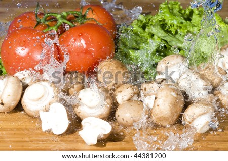 Fresh vegetable and splashing water.Vegetarian food background with water drop