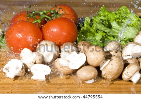 Fresh vegetable and splashing water.Vegetarian food background with water drop