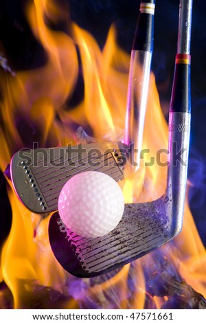 Golf clubs with  ball on black background