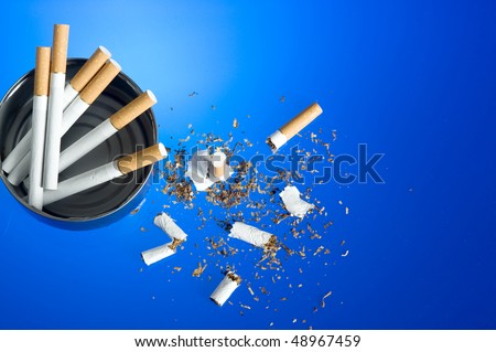 Cigarette on blue background. Cood for anti smoking issues