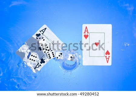 Several dice combination and playing cards on water