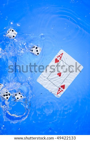 Several dice combination and playing cards on water