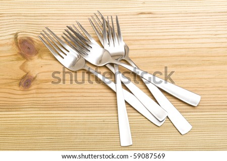 Background with silverware. Kitchen utensil on wood background