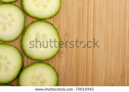 Vegetarian background with fresh green cucumber