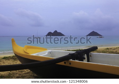 outrigger canoe on the beach in hawaii at dusk