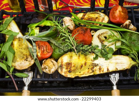 fresh vegetables cooking on a bar-b-que grill