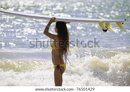 japanese woman surfing in hawaii