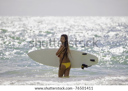 japanese woman surfing in hawaii