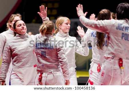 KIEV, UKRAINE - APRIL 13: Team tournament final match of the 2012 Women world fencing on April 13, 2012 in Kiev, Ukraine.