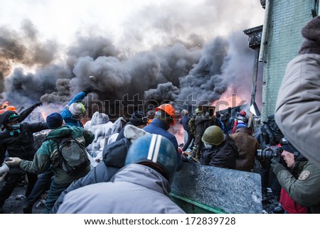 KYIV, UKRAINE - JAN 23: Angry crowd on the occupying street on the demostration during anti-government protest Euromaidan on January 23, 2014, in center of Kiev, Ukraine