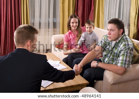 Happy family made a deal with agent at home