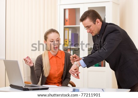 Businessman and businesswoman discuss working hours moments