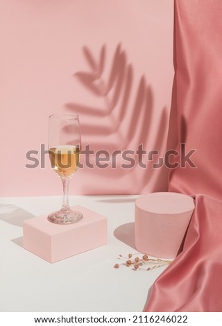 Romantic pastel pink Valentine's Day composition with wine glass, satin curtain and shadow. Suitable for Product Display and Business Concept. Modern aesthetic. ストックフォト © 