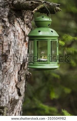 Green lantern with candle