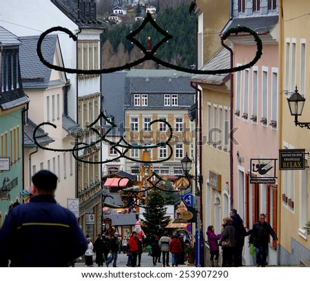Annaberg, Germany - December 20th, 2014: The steep slope street scene on bleak but lively Christmas eve.