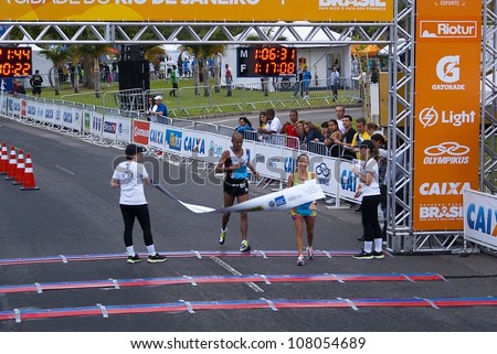 RIO DE JANEIRO - JULY 8: Pamela Chey Echanesouwk  crosses the arrival line in the Maratona do Rio de Janeiro. Event Maratona do Rio; July 8, 2012 at Rio de Janeiro, Brazil