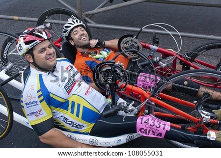 RIO DE JANEIRO - JULY 8: unidentified deficient physicists talk after cross  the arrival line in their tricycles in the Maratona do Rio. Event Maratona do Rio; July 8, 2012 at Rio de Janeiro, Brazil