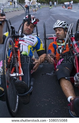 RIO DE JANEIRO - JULY 8: deficient physicists talk after cross  the arrival line in their tricycles in the Maratona do Rio. Event Maratona do Rio; July 8, 2012 at Rio de Janeiro, Brazil