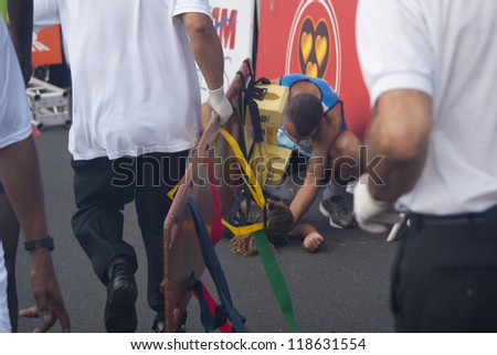 RIO DE JANEIRO - NOV 11: unidentified athlete faints after crossing the arrival line at event Corrida Eu Atleta 10K Rio at November 11, 2012 Rio de Janeiro, Brazil