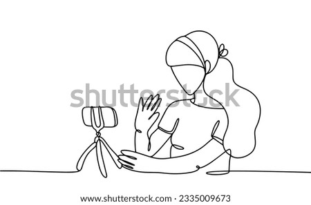 The girl blogger broadcasts live for subscribers. World Bloggers Day. One line drawing for different uses. Vector illustration.