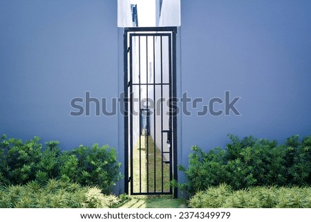 Similar – Image, Stock Photo Wooden gate between two houses with no trespassing sign.