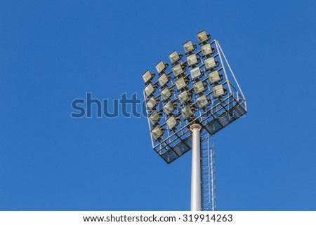 Multiple sport light with blue background, spotlight and place for text