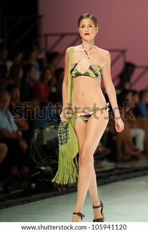 CANARY ISLANDS -JUNE 23: An unidentified model walks the runway in the Miss Bikini collection during Gran Canaria Moda Calida swimwear fashion show on June 23, 2012 in Canary Islands, Spain