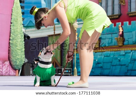 LAS PALMAS - FEBRUARY 16: Maria Jose Bonillo Fresco, from Canary Islands, with her French Bulldog onstage during the Carnival\'s Dogs Contest February 16, 2014 in Las Palmas, Spain